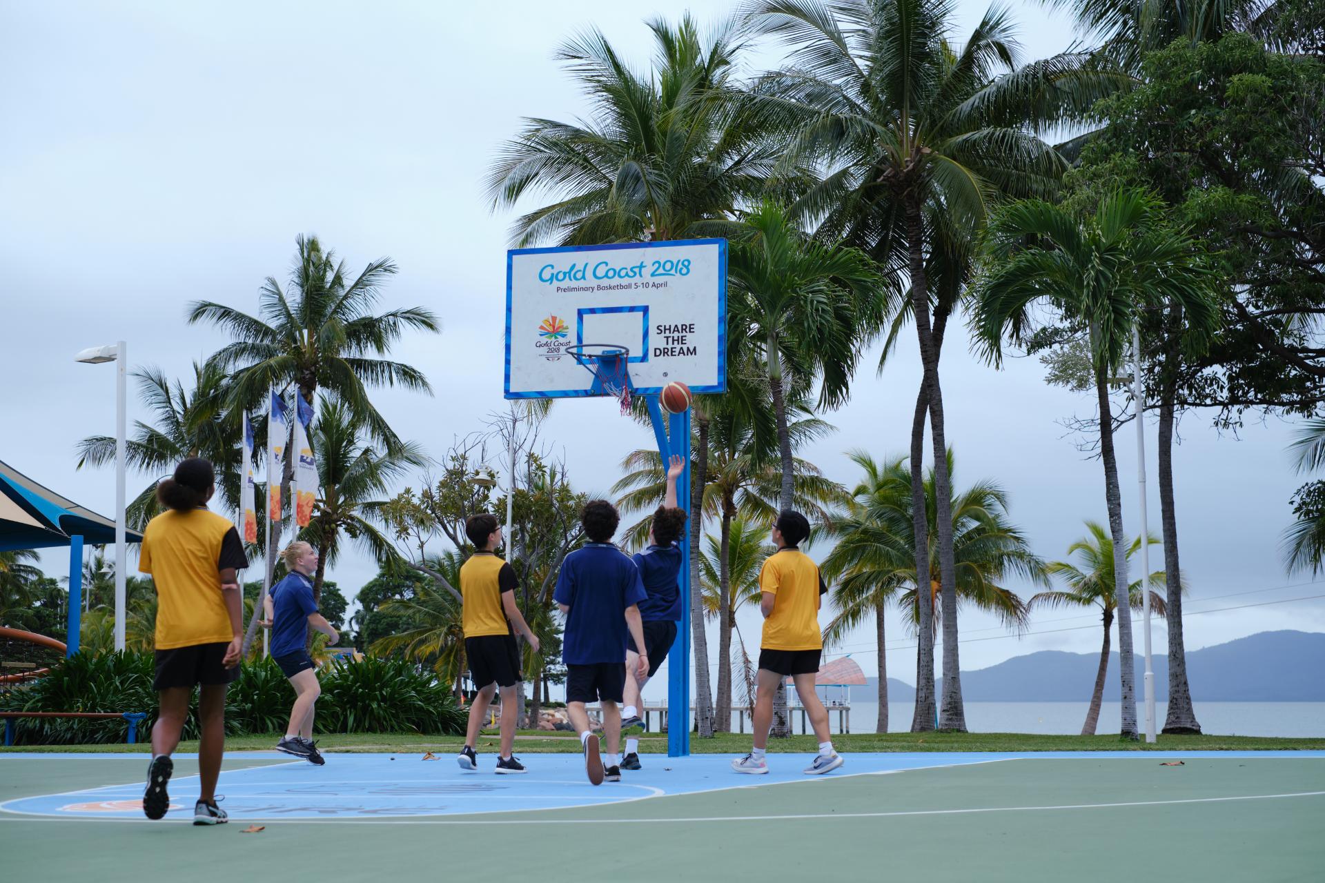 Group playing basketball on The Strand in Townsville.